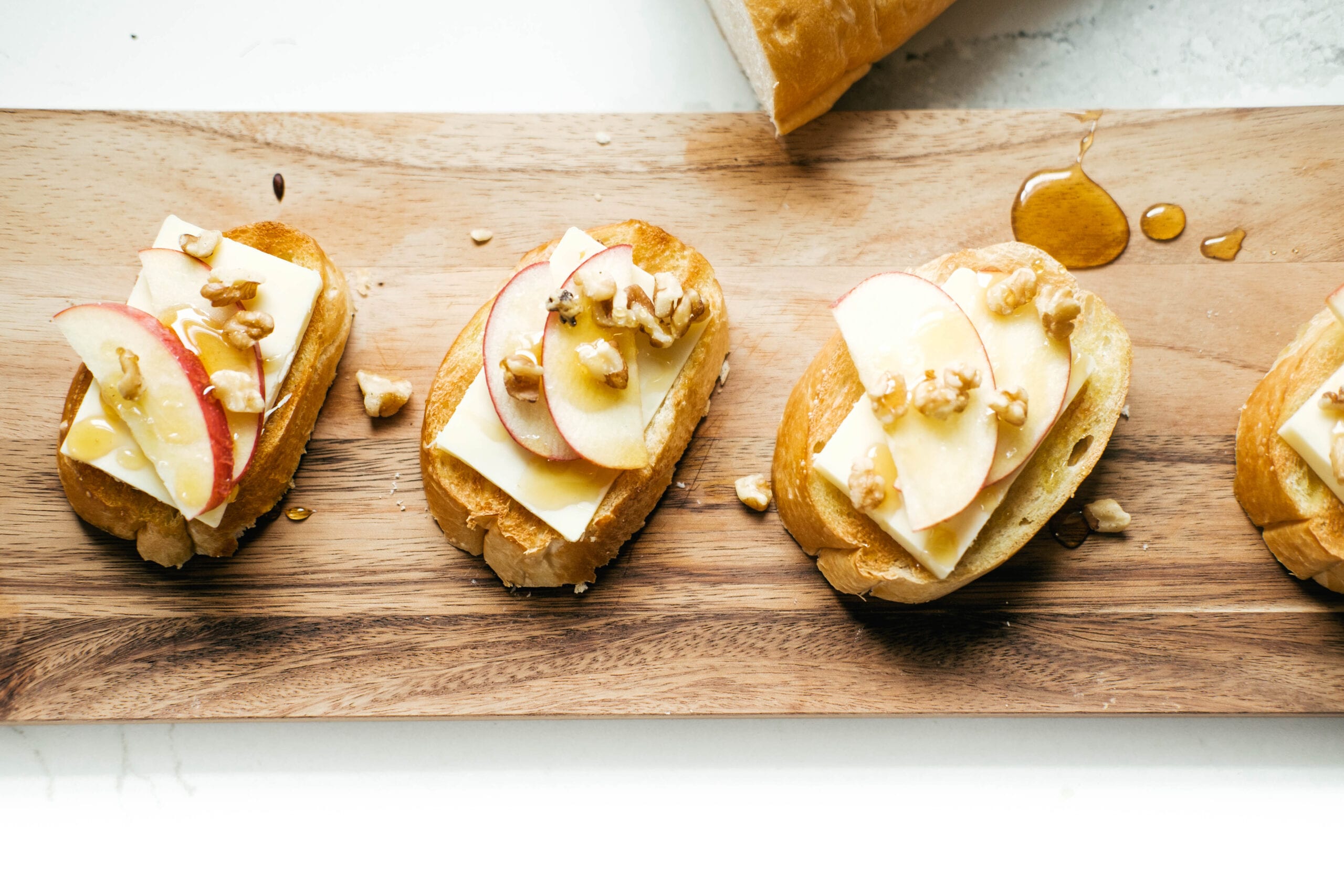 apple walnut toast on a cutting board