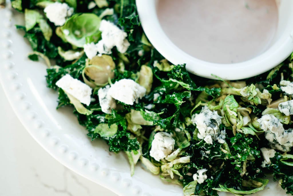 blue cheese on kale and Brussels sprout salad