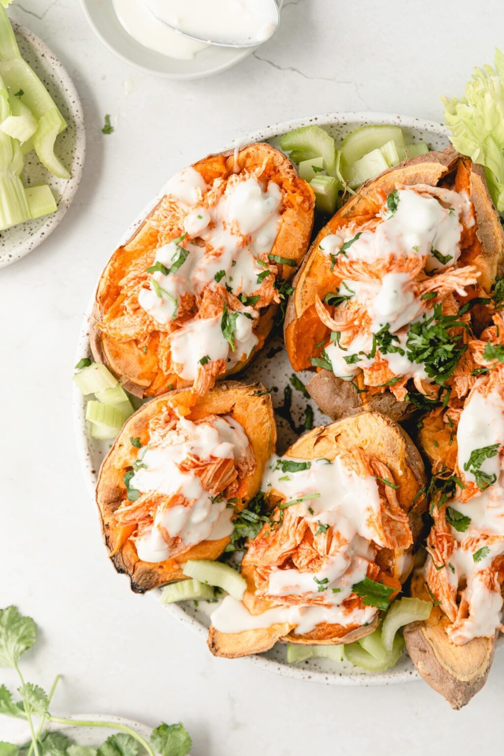 Healthy Shredded Buffalo Chicken in Sweet Potatoes
