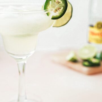 Spicy margarita garnished with jalapeno and lime.