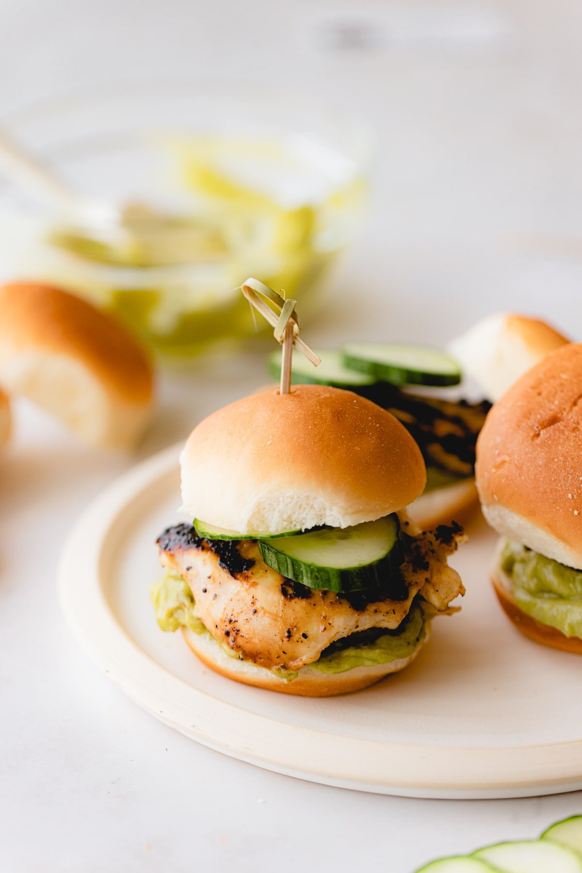 An avocado ranch chicken slider on Hawaiian roll.