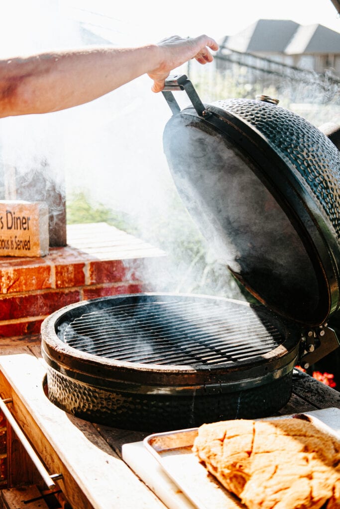 Big Green Egg Smoker pouring out smoke