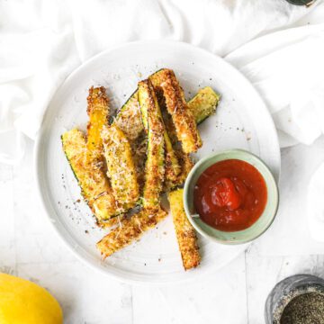 Plate of squash fries with ketchup on white plate