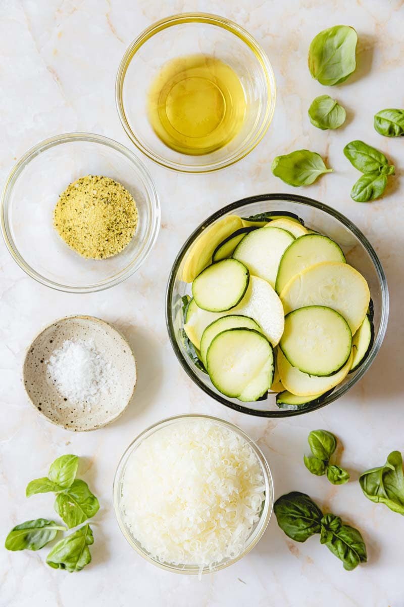 Air Fryer Zucchini Squash ingredients in glass bowls.