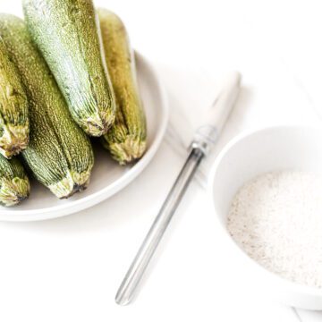 Kousa squash next to a corer