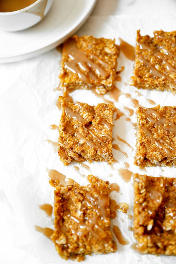 maple pumpkin oatmeal bars drizzled with a maple almond glaze