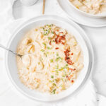 clam chowder with bacon and chive topping