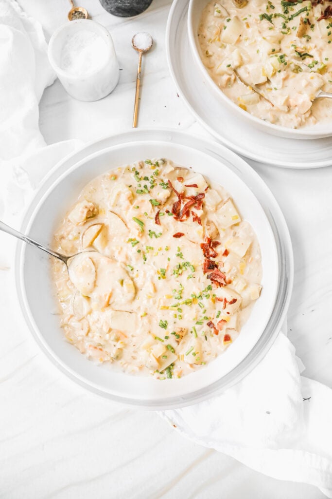 clam chowder with bacon and chive topping