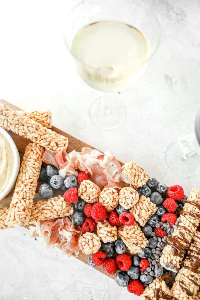 crunchy rollers grazing board with white wine