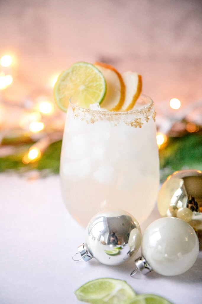 pear margarita with Christmas ornaments around it 
