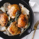 rosemary white wine chicken thighs in cast iron skillet