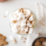 top down shot of white hot chocolate topped with marshmallows