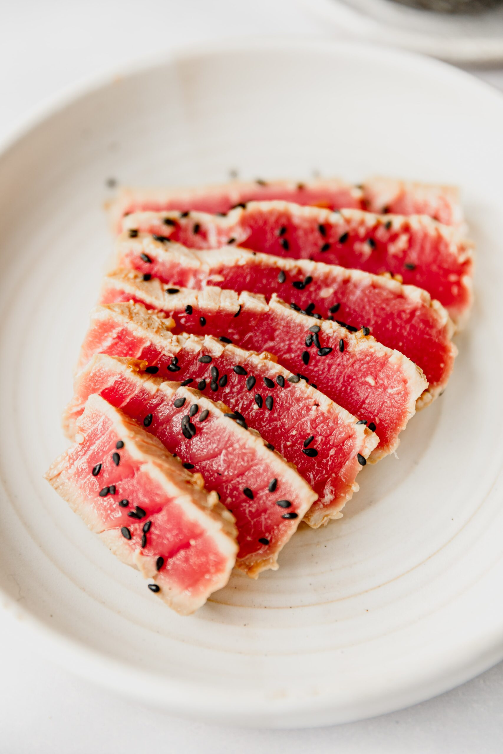 sliced seared Ahi Tuna garnished with black sesame seeds