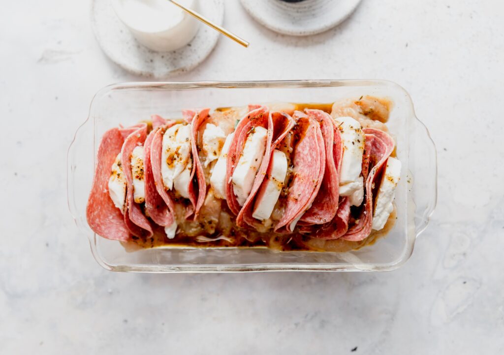 pepperoni and mozzarella stuffed turkey tenderloin in a pyrex dish 