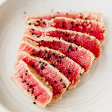 seared ahi tuna sliced and garnished with black sesame seeds