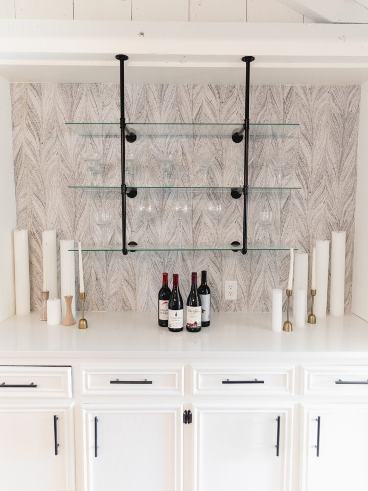 4 red wines on a white bar