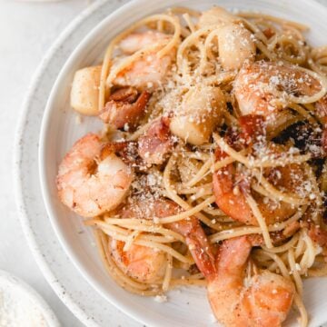close up of shrimp on pasta with scallops