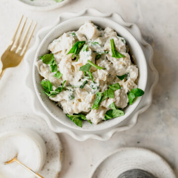 bowl of spinach artichoke chicken salad