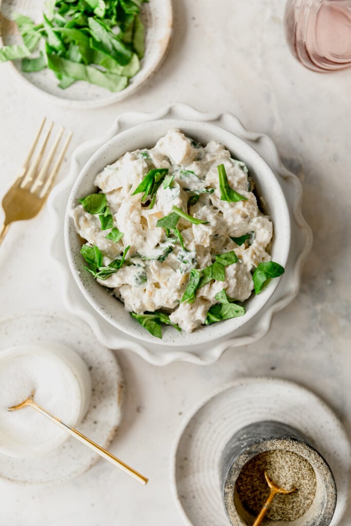 bowl of spinach artichoke chicken salad