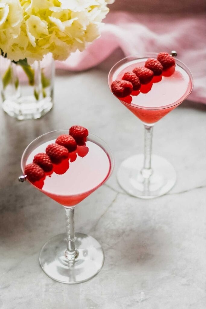 raspberry martini garnished with fresh raspberry