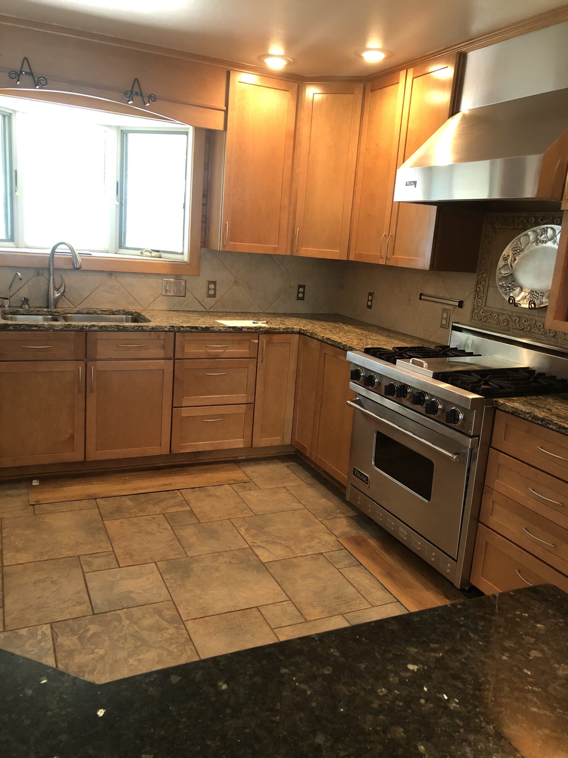 Maple cabinets and tile floor kitchen