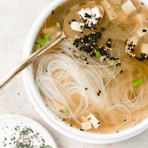 bowl of miso soup with gold spoon