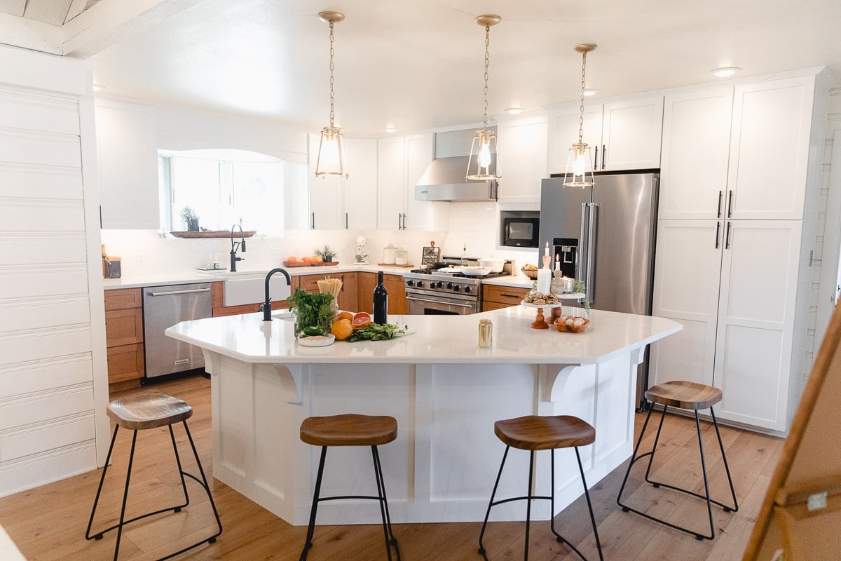 White kitchen with lower maple cabinets 
