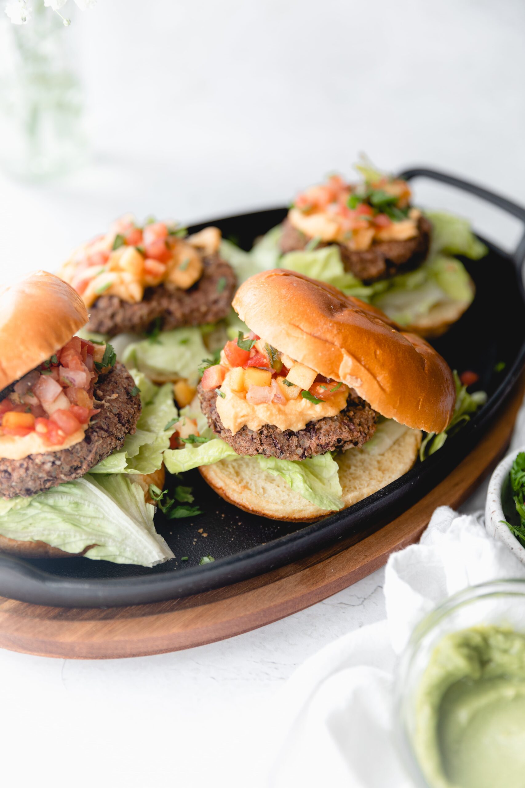 close up of nacho black bean burger with bun on top