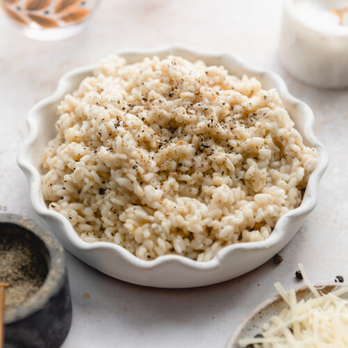 scalloped bowl of cacio e pepe risotto