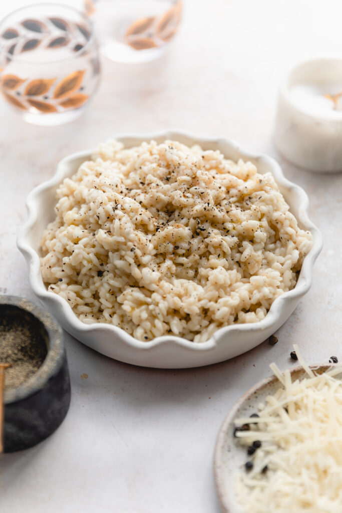 scalloped bowl of cacio e pepe risotto