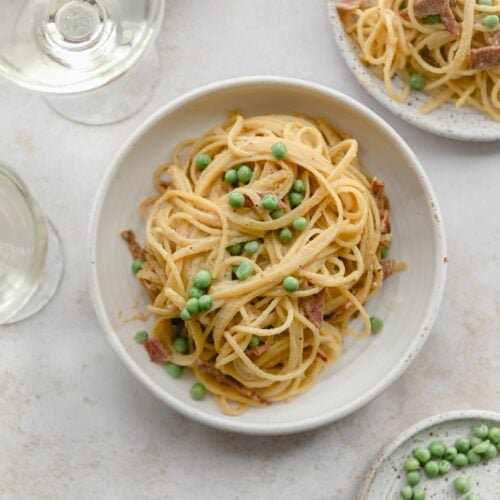 bowl of pasta carbonara in a white bowl