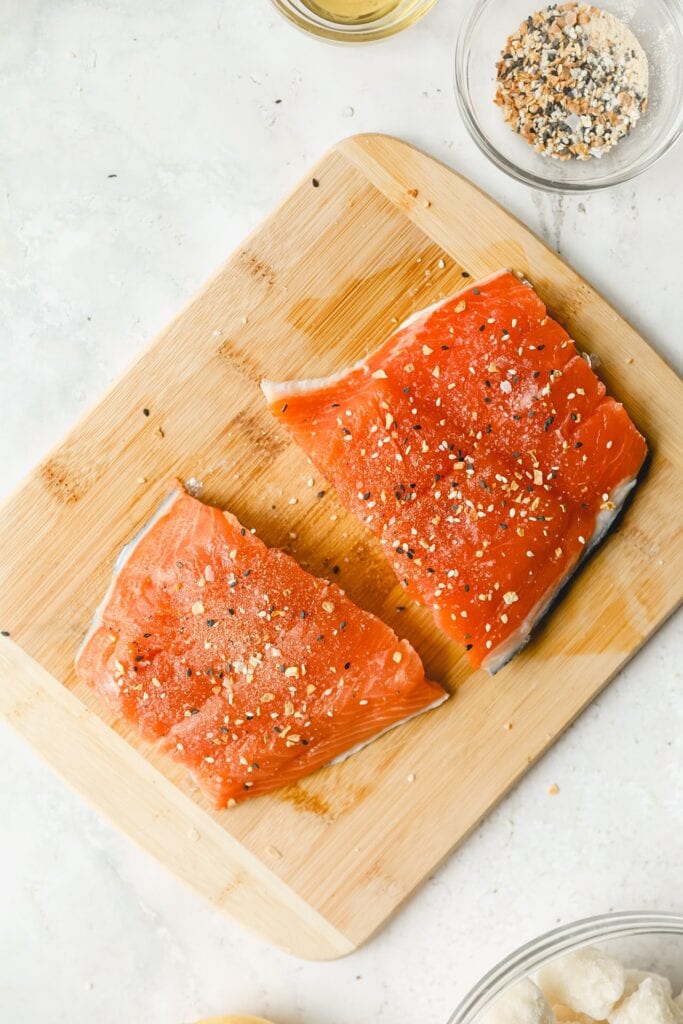 seasoned salmon on cutting board