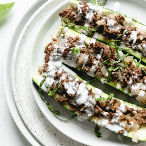 stuffed courgettes on a white plate