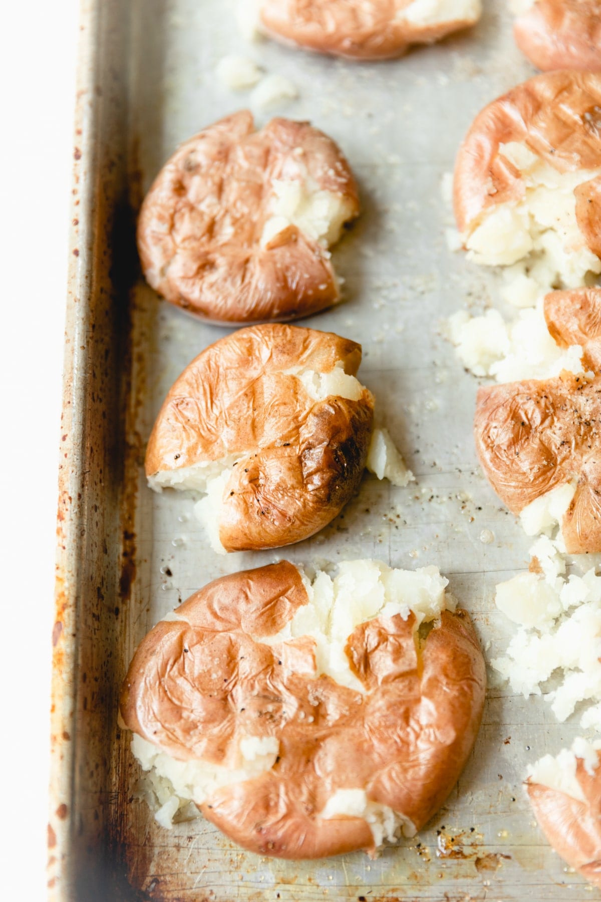 red potatoes, roasted and smashed on a sheet tray