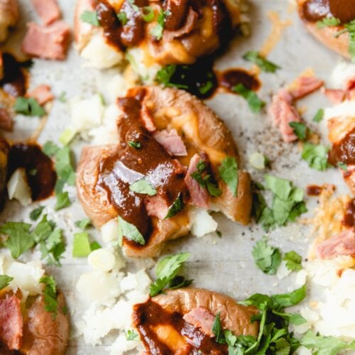 sheet tray with smashed potatoes and toppings