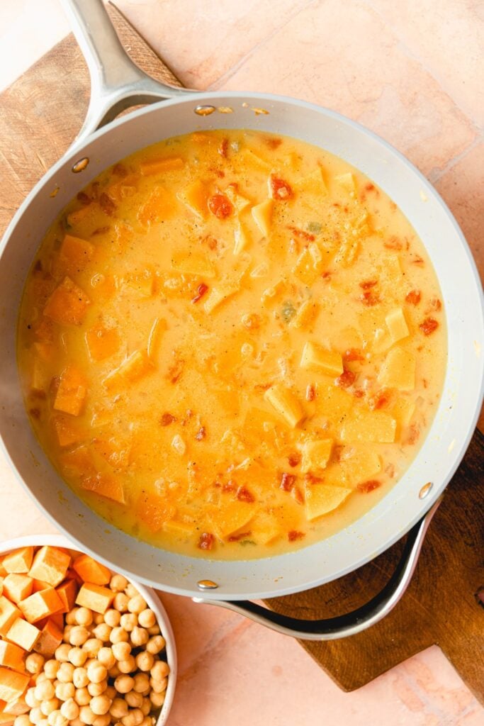 squash and sweet potato curry in a skillet