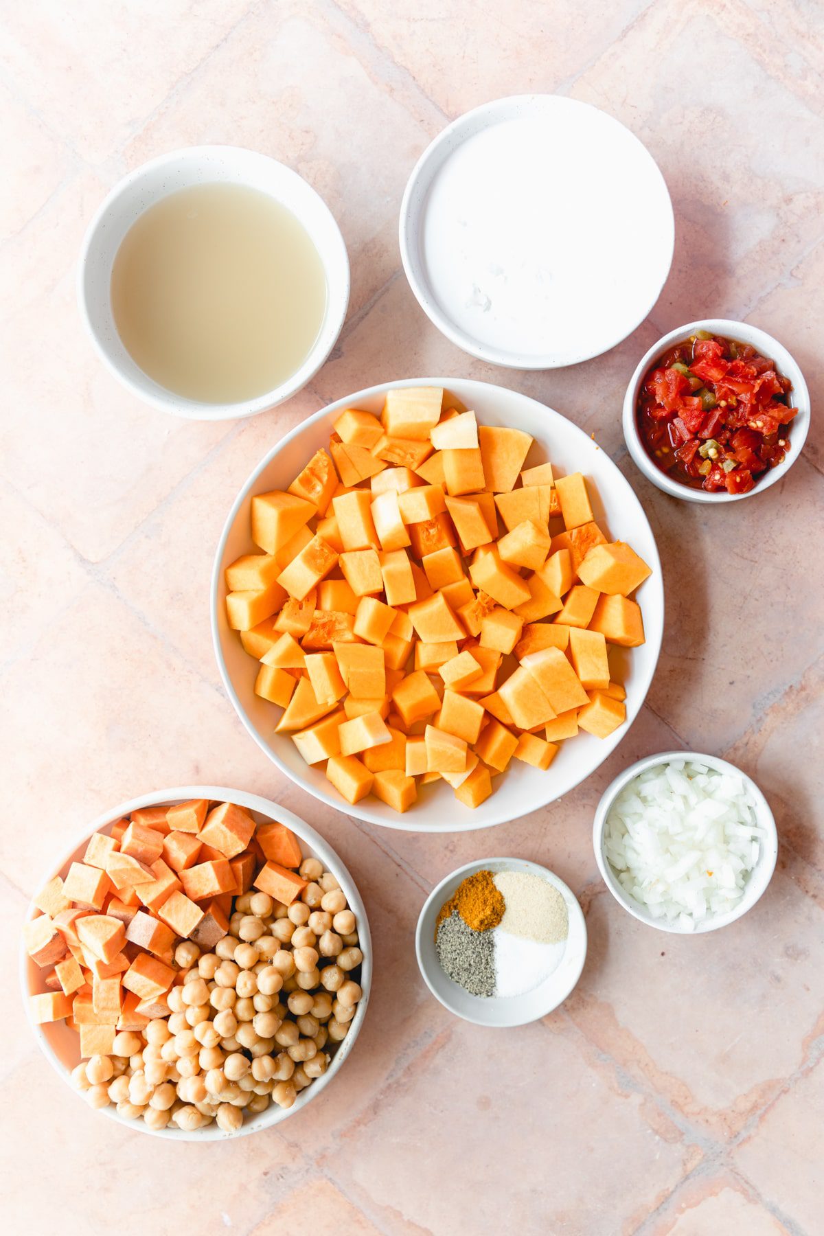 butternut squash curry ingredients in white bowls
