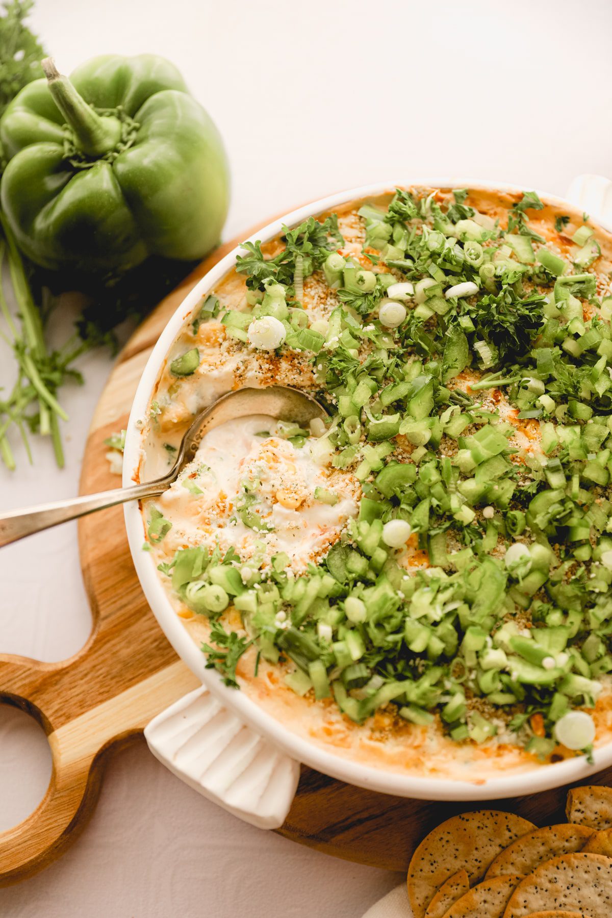 white bowl of shrimp dip with a spoon in it.