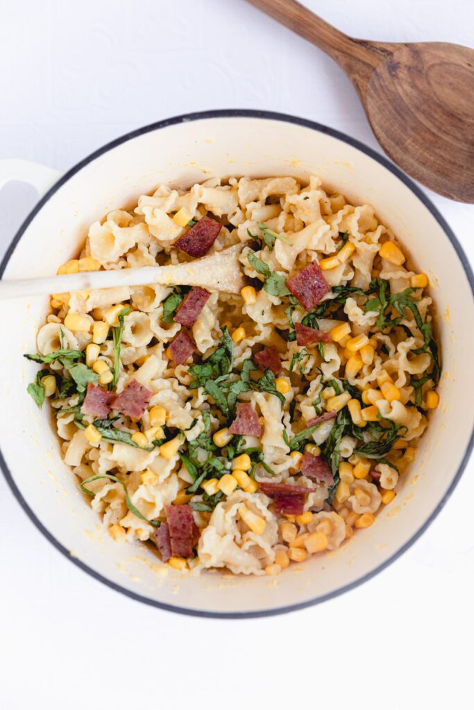 skillet with the pasta, bacon, sweet corn and basil