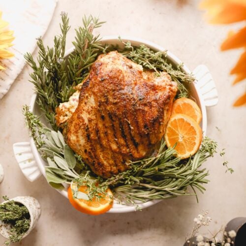 turkey roulade on a plate dressed up with orange slices