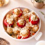 white baking dish with savory stuffed apples