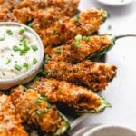 plate of air fried jalapeno poppers served with ranch
