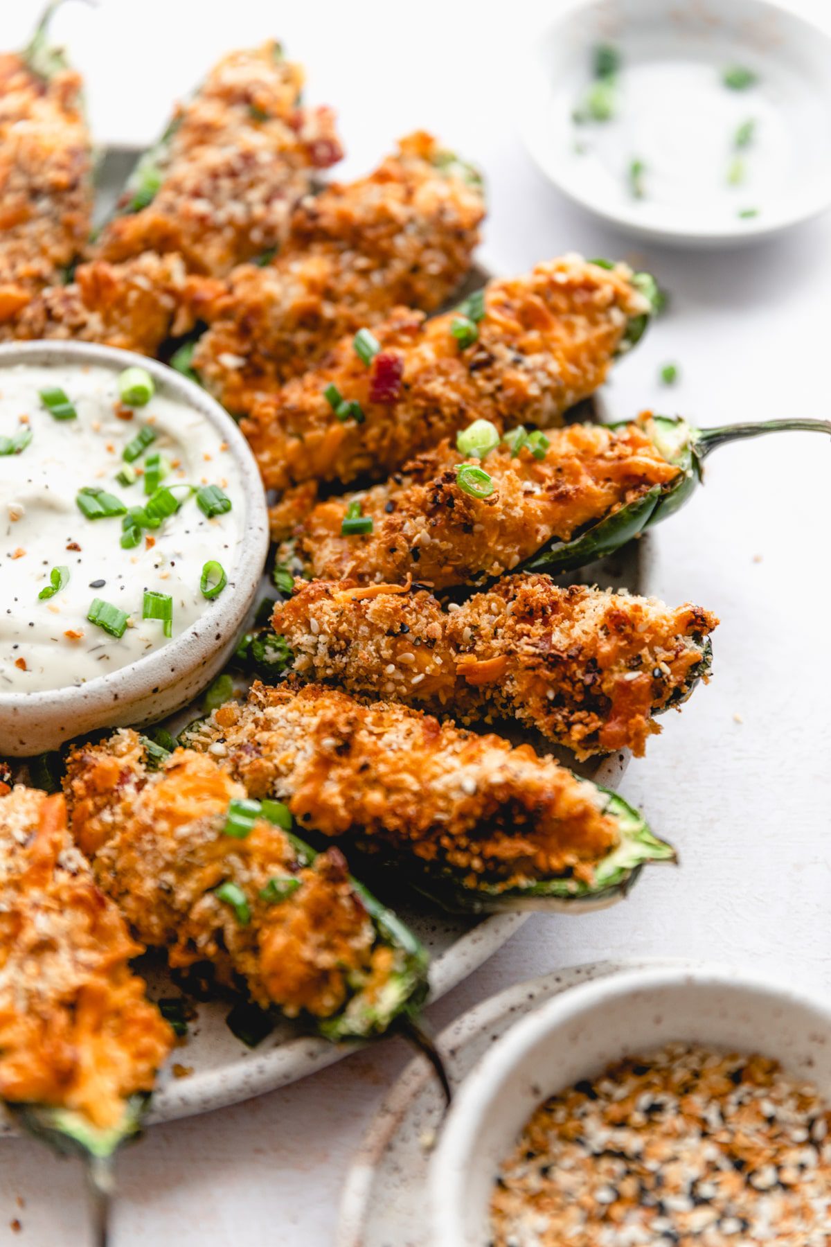 plate of air fried jalapeno poppers served with ranch