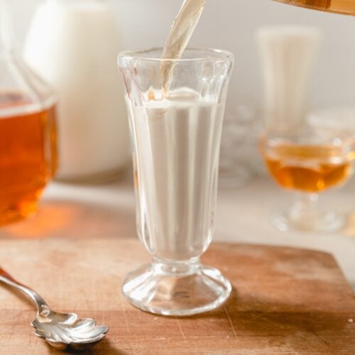 bourbon cream in a glass jar pouring a cream soda
