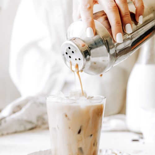 pouring iced chocolate espresso into a glass