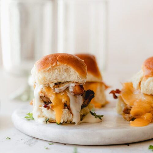 chicken bacon sliders on a white plate