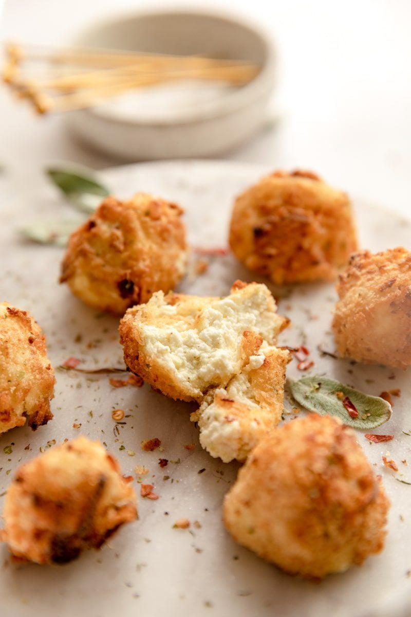 plate with fried goat cheese balls, one cut in half