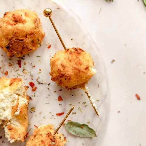 tooth pick through a fried goat cheese ball