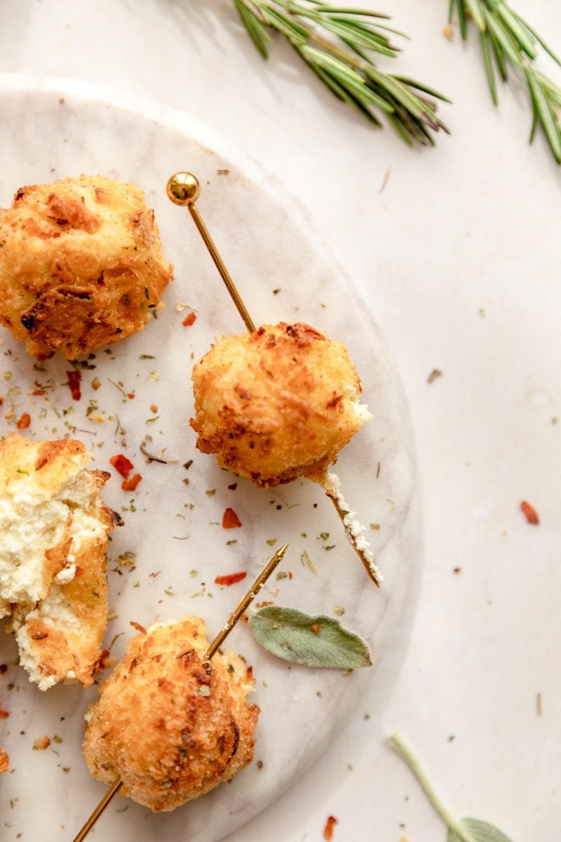 tooth pick through a fried goat cheese ball