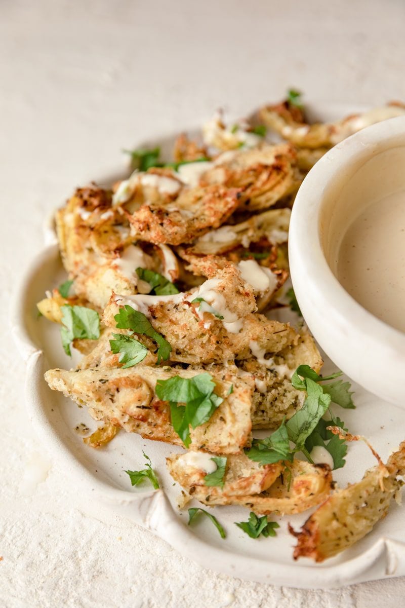 plate of artichoke hearts with a garlic aioli sauce